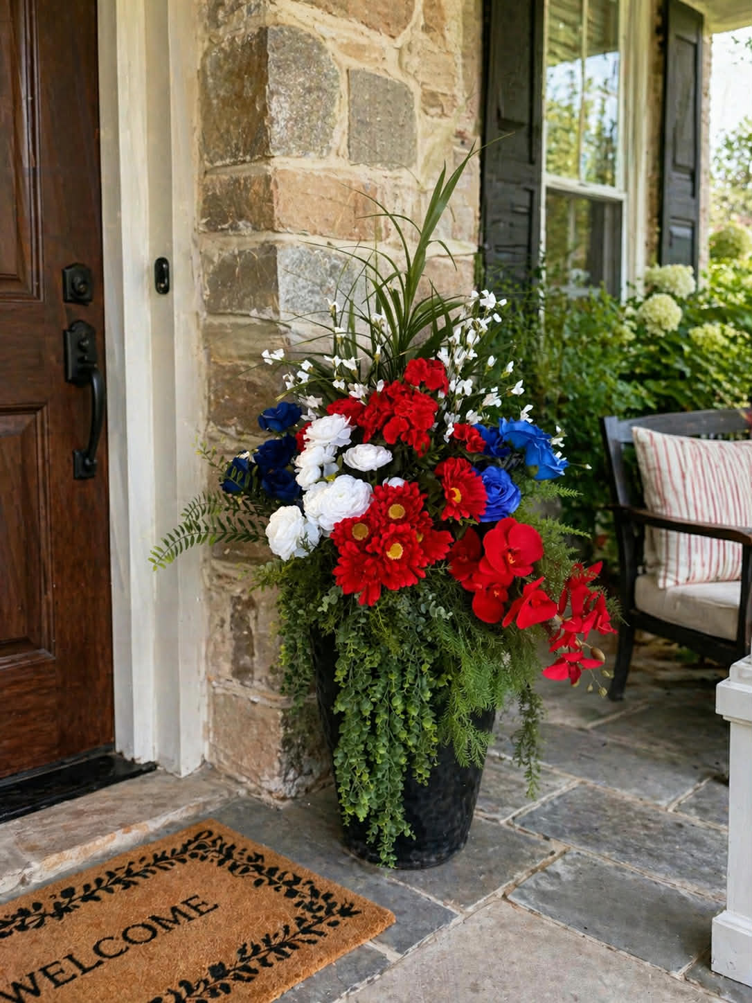 Front porch planter with red, white and blue florals